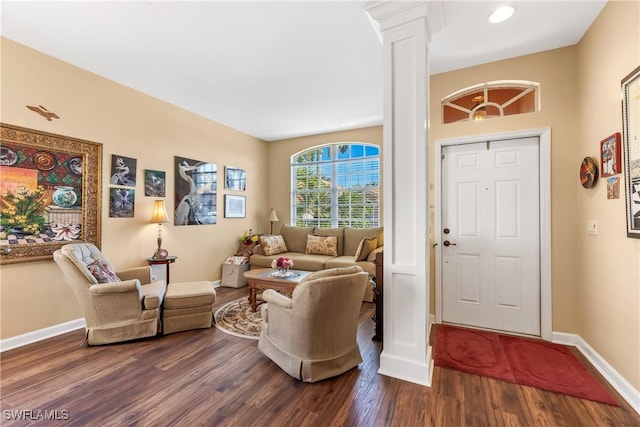 entryway with hardwood / wood-style flooring and ornate columns