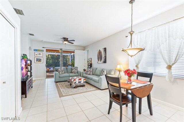 tiled living room featuring ceiling fan