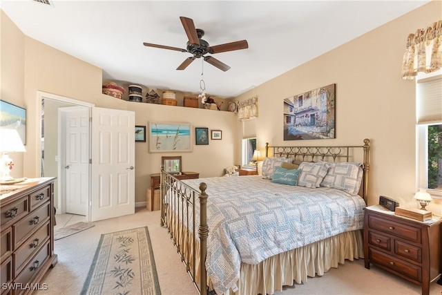 bedroom featuring light colored carpet and ceiling fan