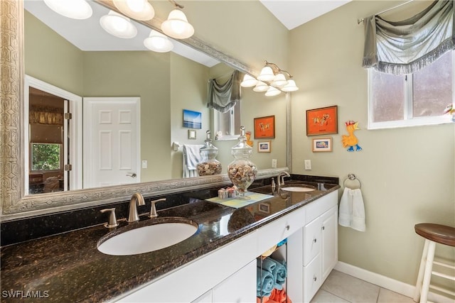 bathroom featuring plenty of natural light, vanity, and tile patterned flooring