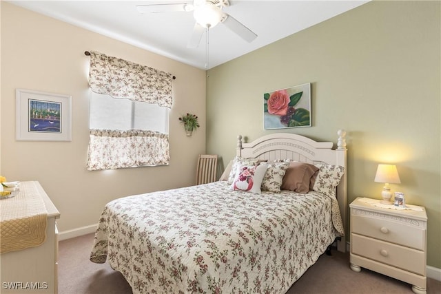 bedroom with dark carpet and ceiling fan