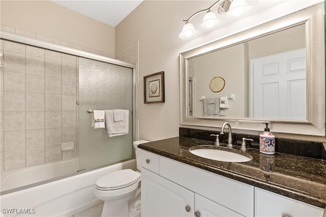 full bathroom with toilet, vanity, and combined bath / shower with glass door