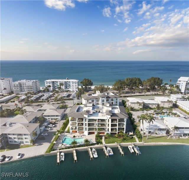 birds eye view of property featuring a water view