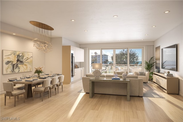 living room featuring light hardwood / wood-style flooring and a notable chandelier