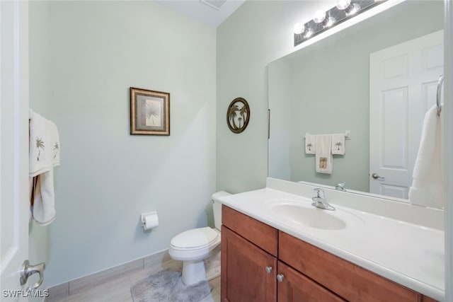 bathroom with vanity and toilet