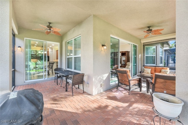 view of patio featuring ceiling fan and an outdoor hangout area