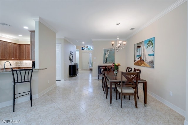 dining space with crown molding, sink, and an inviting chandelier