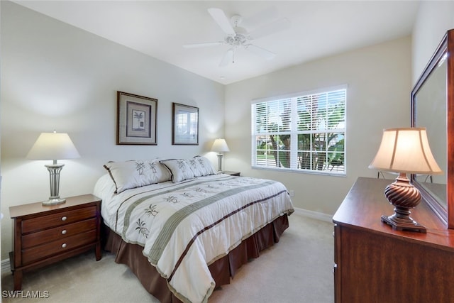 bedroom featuring light colored carpet and ceiling fan