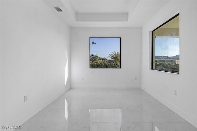 empty room with a tray ceiling