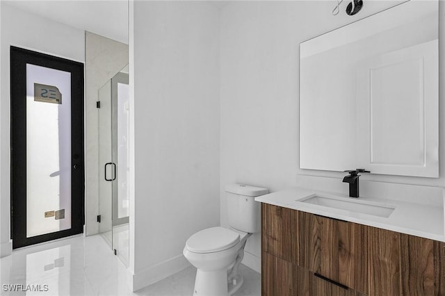 bathroom featuring vanity, toilet, and walk in shower