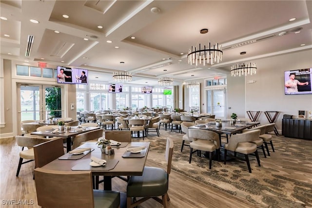 dining room featuring a chandelier, french doors, and light hardwood / wood-style flooring