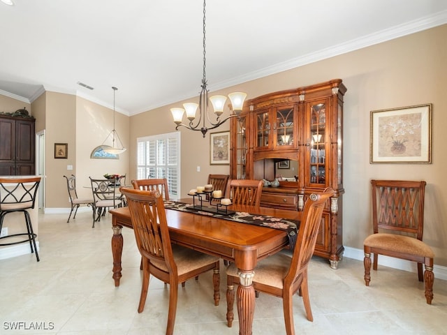 dining space with an inviting chandelier and ornamental molding