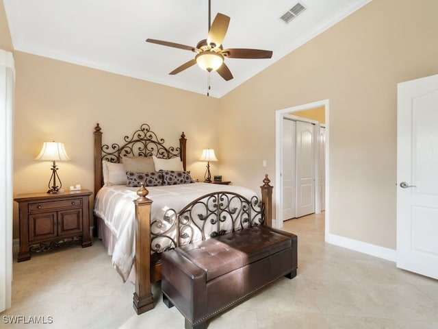 bedroom with ceiling fan, a closet, lofted ceiling, and ornamental molding