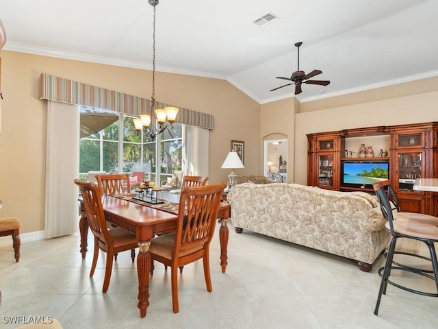 dining area featuring vaulted ceiling, crown molding, and ceiling fan with notable chandelier