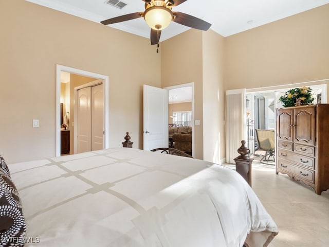 bedroom featuring ceiling fan and ornamental molding