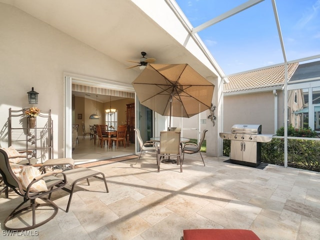 view of patio / terrace with glass enclosure, grilling area, and ceiling fan