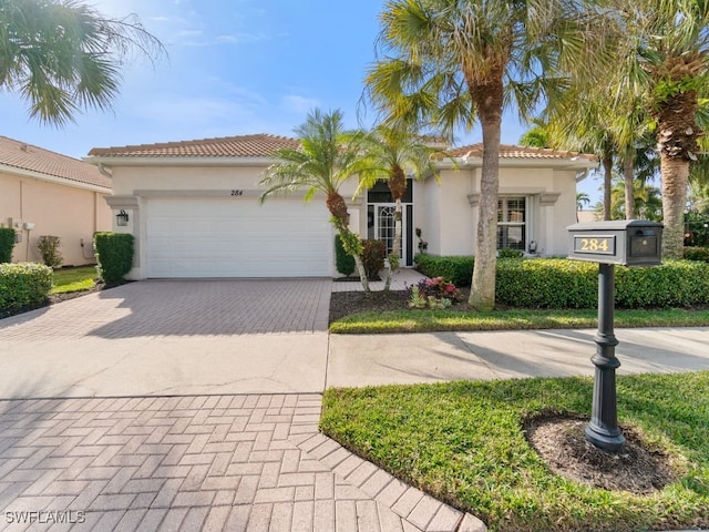 mediterranean / spanish-style house featuring a garage