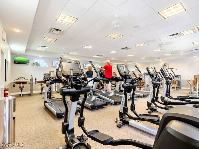 workout area with a paneled ceiling