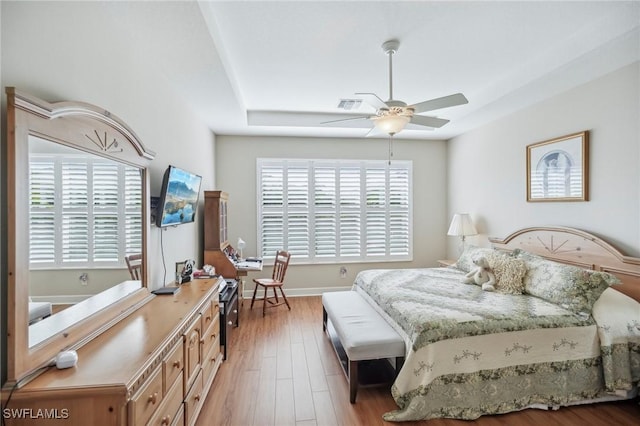 bedroom with ceiling fan and light hardwood / wood-style flooring