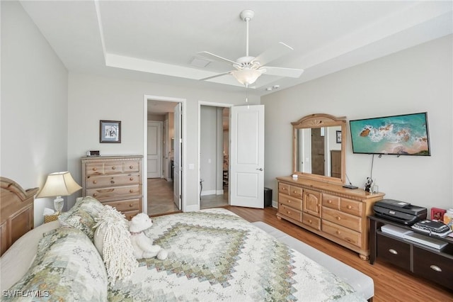 bedroom with ceiling fan and hardwood / wood-style flooring