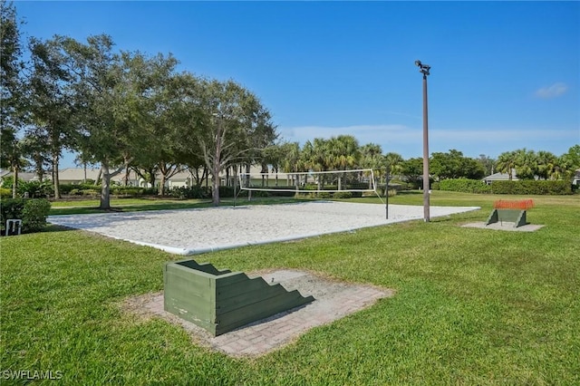 view of home's community featuring volleyball court and a yard