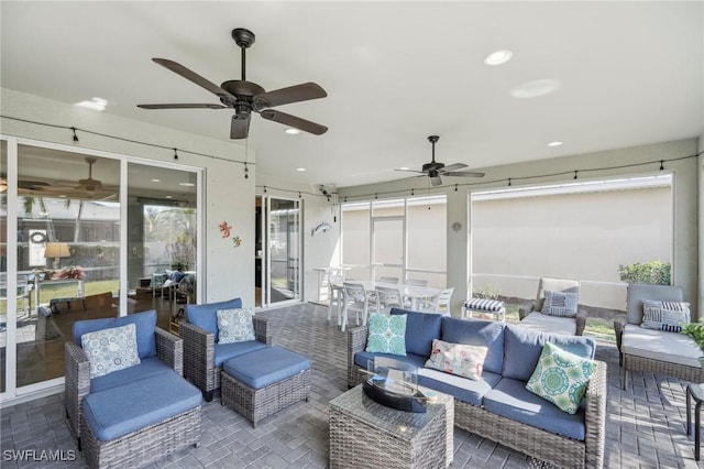 view of patio / terrace featuring outdoor lounge area, a ceiling fan, and outdoor dining space