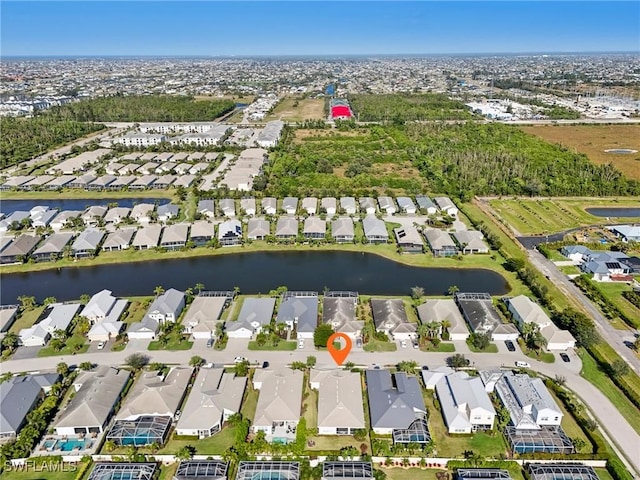 aerial view with a water view and a residential view