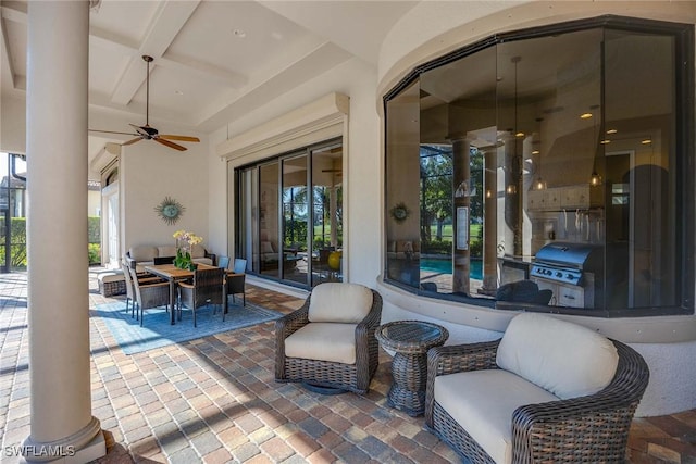 view of patio featuring a grill and ceiling fan