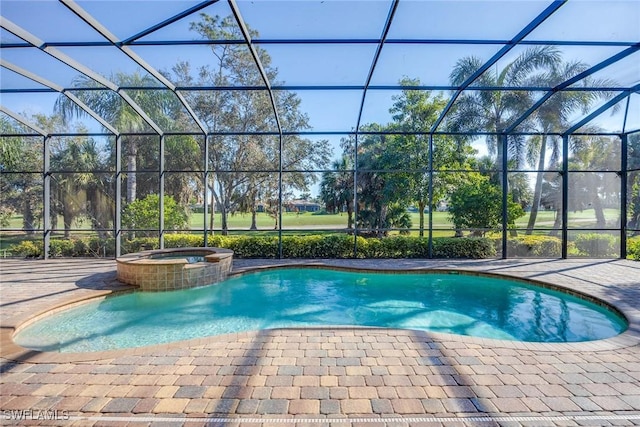 view of swimming pool with an in ground hot tub, a lanai, and a patio area