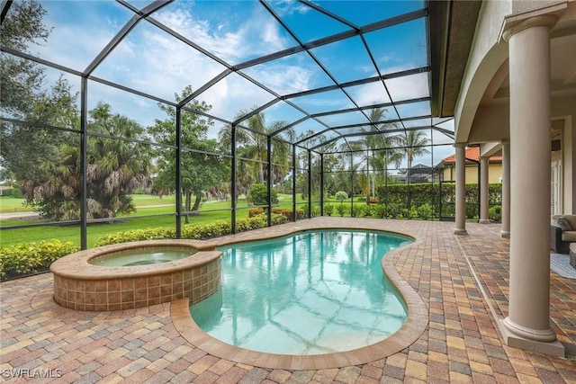 view of pool featuring an in ground hot tub, a lanai, and a patio area