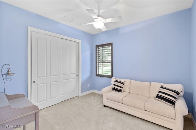 living room with light carpet and ceiling fan