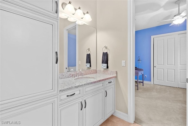 bathroom featuring ceiling fan and vanity