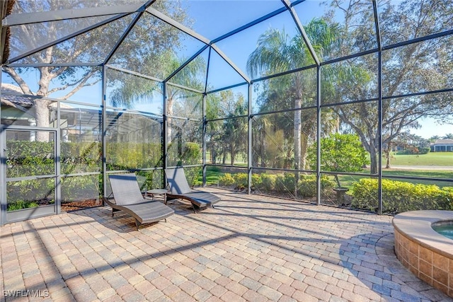 view of patio with a lanai