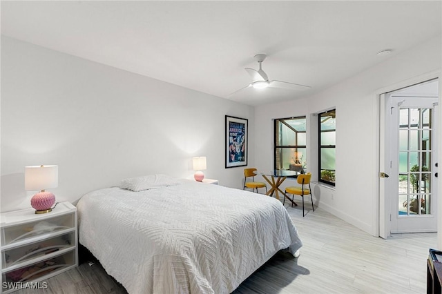 6600 Tannin Ln Unit C, Naples, FL 34109 - bedroom with multiple windows, light hardwood / wood-style flooring, and ceiling fan