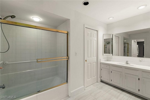 6600 Tannin Ln Unit C, Naples, FL 34109 - bathroom featuring vanity and combined bath / shower with glass door