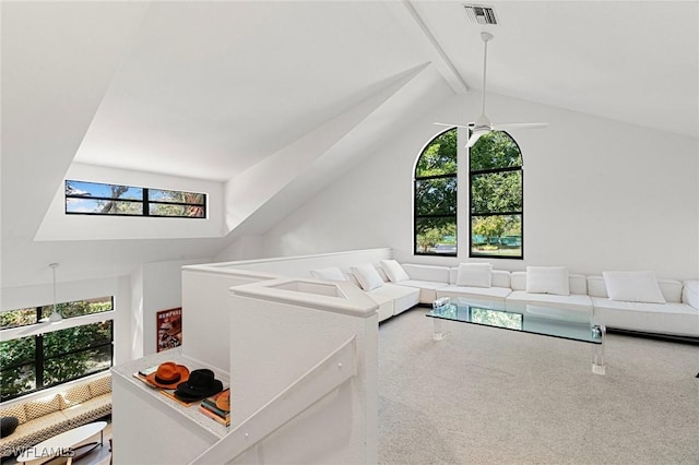 6600 Tannin Ln Unit C, Naples, FL 34109 - carpeted living room with beamed ceiling, high vaulted ceiling, and ceiling fan