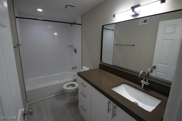 full bathroom featuring shower / tub combination, hardwood / wood-style floors, vanity, and toilet