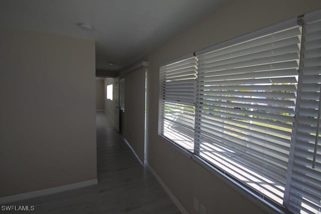 hall with dark hardwood / wood-style floors