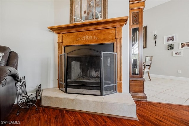 room details with hardwood / wood-style floors and a fireplace