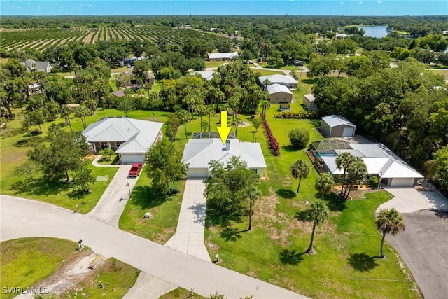 birds eye view of property with a rural view