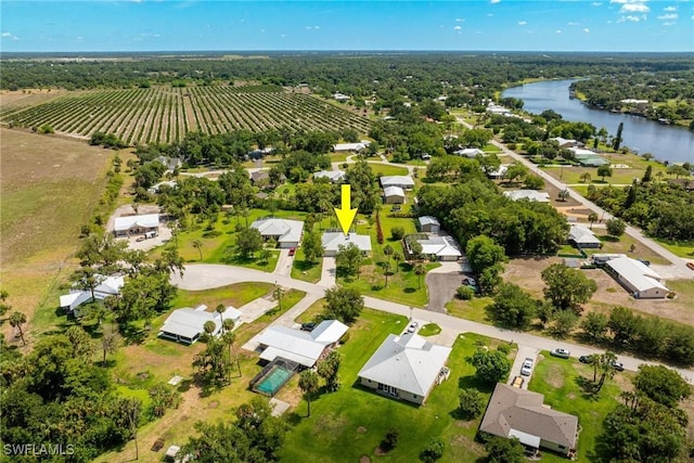 drone / aerial view with a water view and a rural view