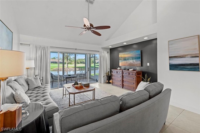 living room featuring ceiling fan, high vaulted ceiling, and light tile patterned floors