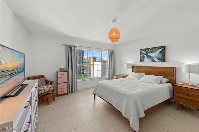 bedroom with light tile patterned floors