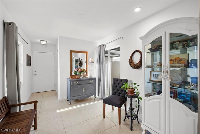 interior space featuring light tile patterned floors and recessed lighting