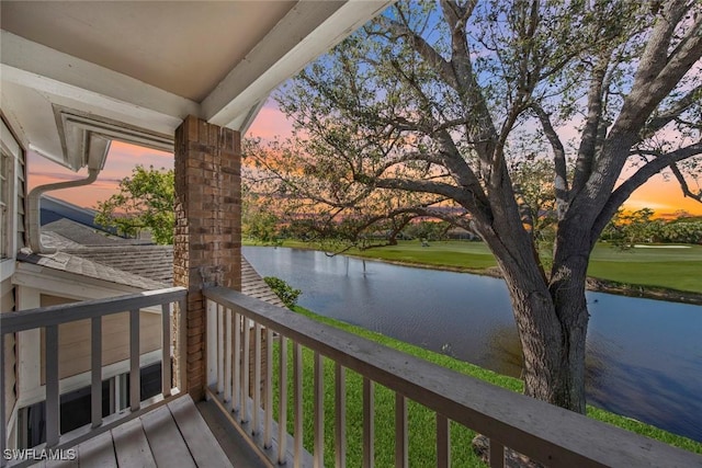 balcony at dusk with a water view