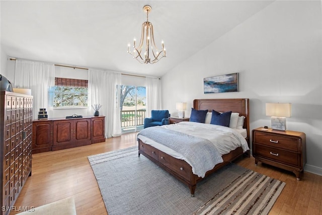 bedroom featuring an inviting chandelier, lofted ceiling, light hardwood / wood-style flooring, and access to outside