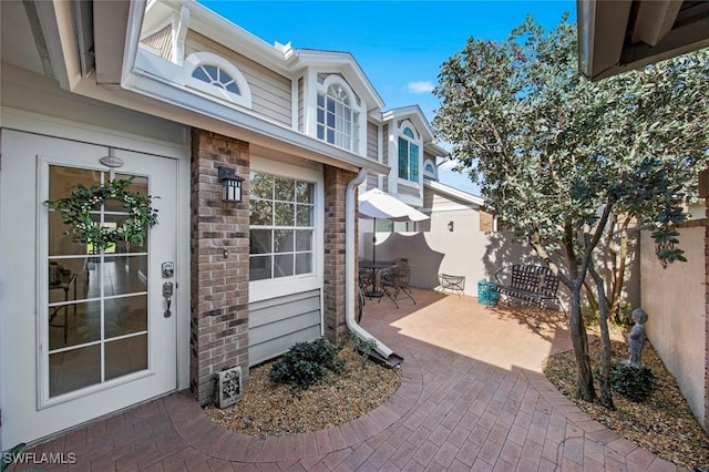 doorway to property with a patio