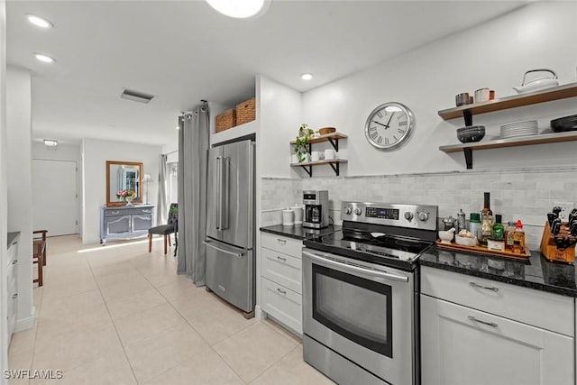 kitchen with light tile patterned floors, visible vents, appliances with stainless steel finishes, open shelves, and tasteful backsplash