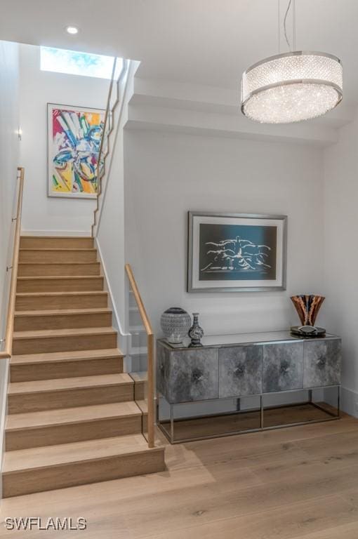 stairway with hardwood / wood-style flooring