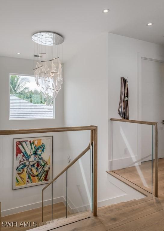 details featuring hardwood / wood-style floors and a chandelier